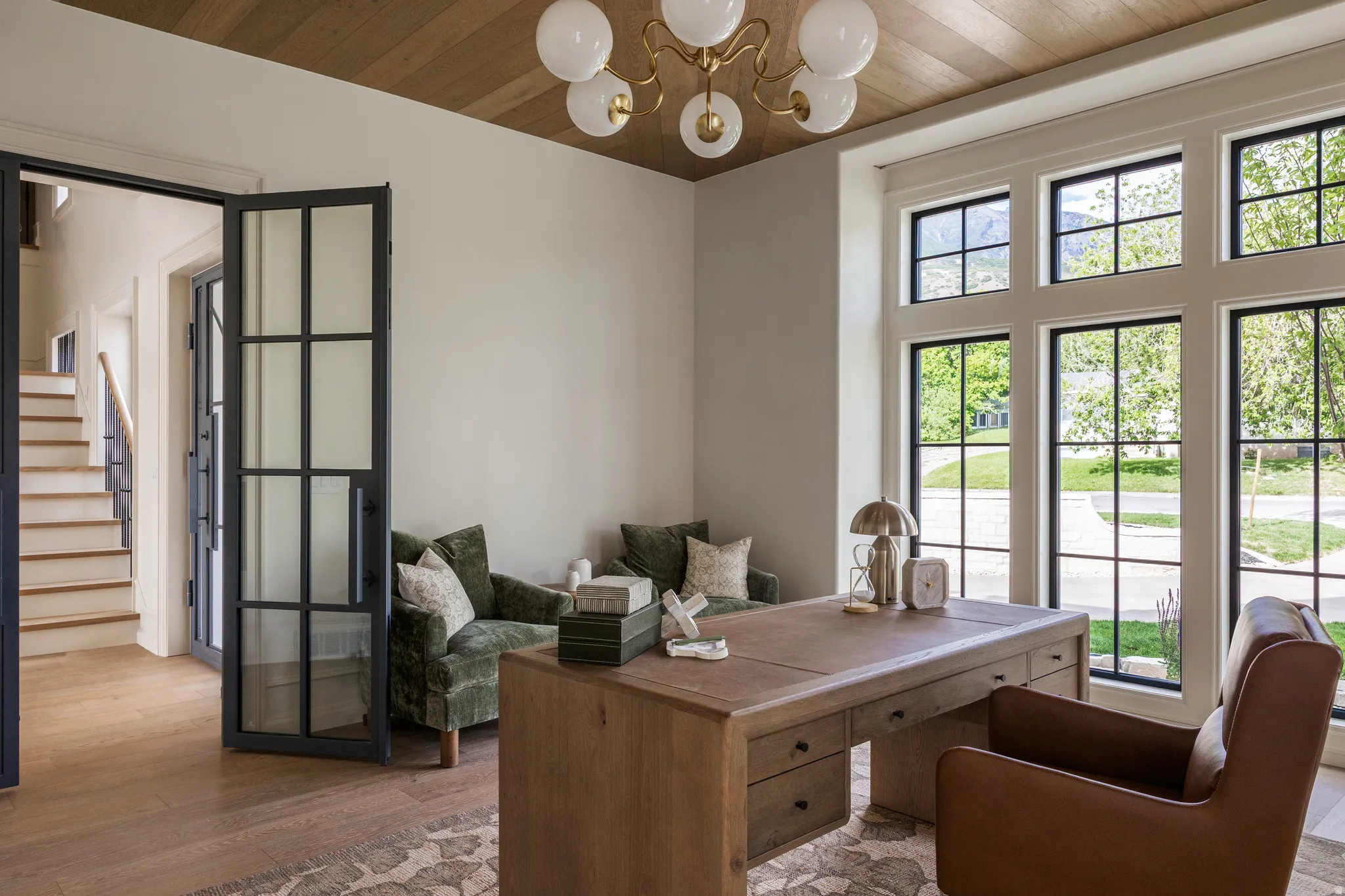 Room featuring wood-finish flooring, a wood plank ceiling, and a multi-globe chandelier