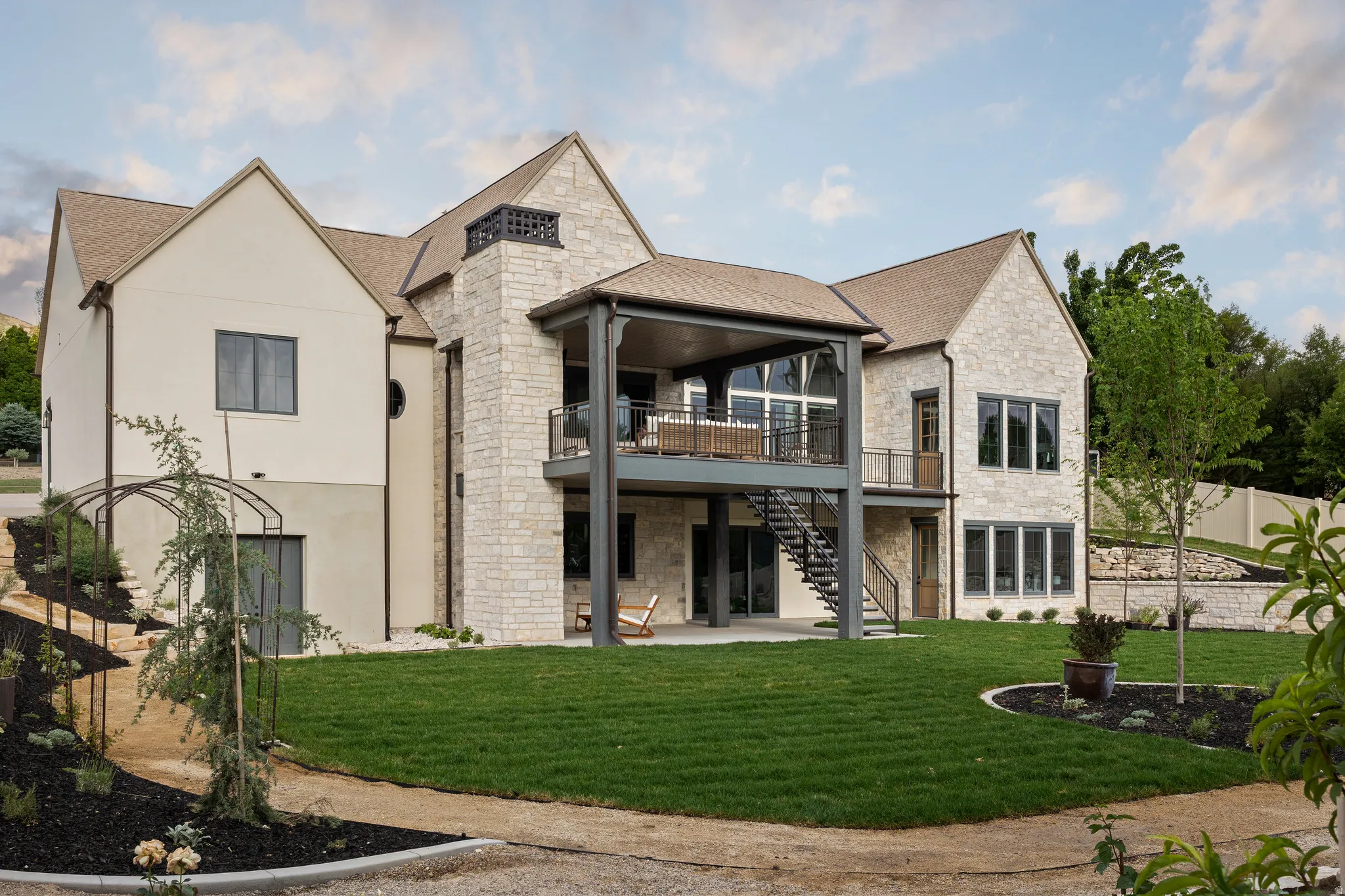 Contemporary residence featuring stone and stucco exterior finishes