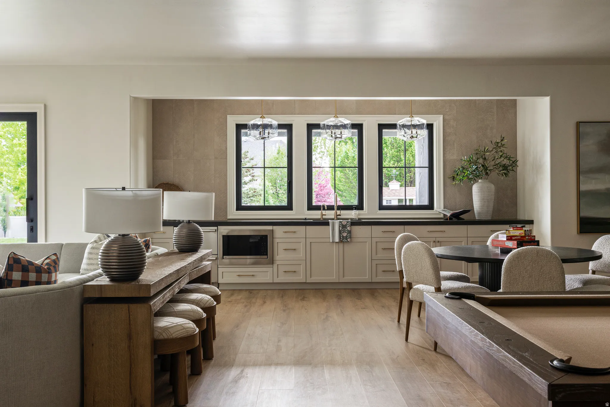Open-concept living space with wood-finish flooring