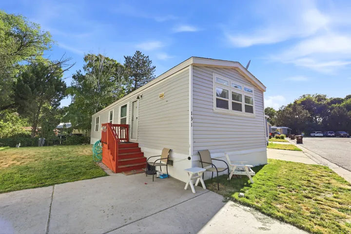 Light gray horizontal siding exterior with white trim