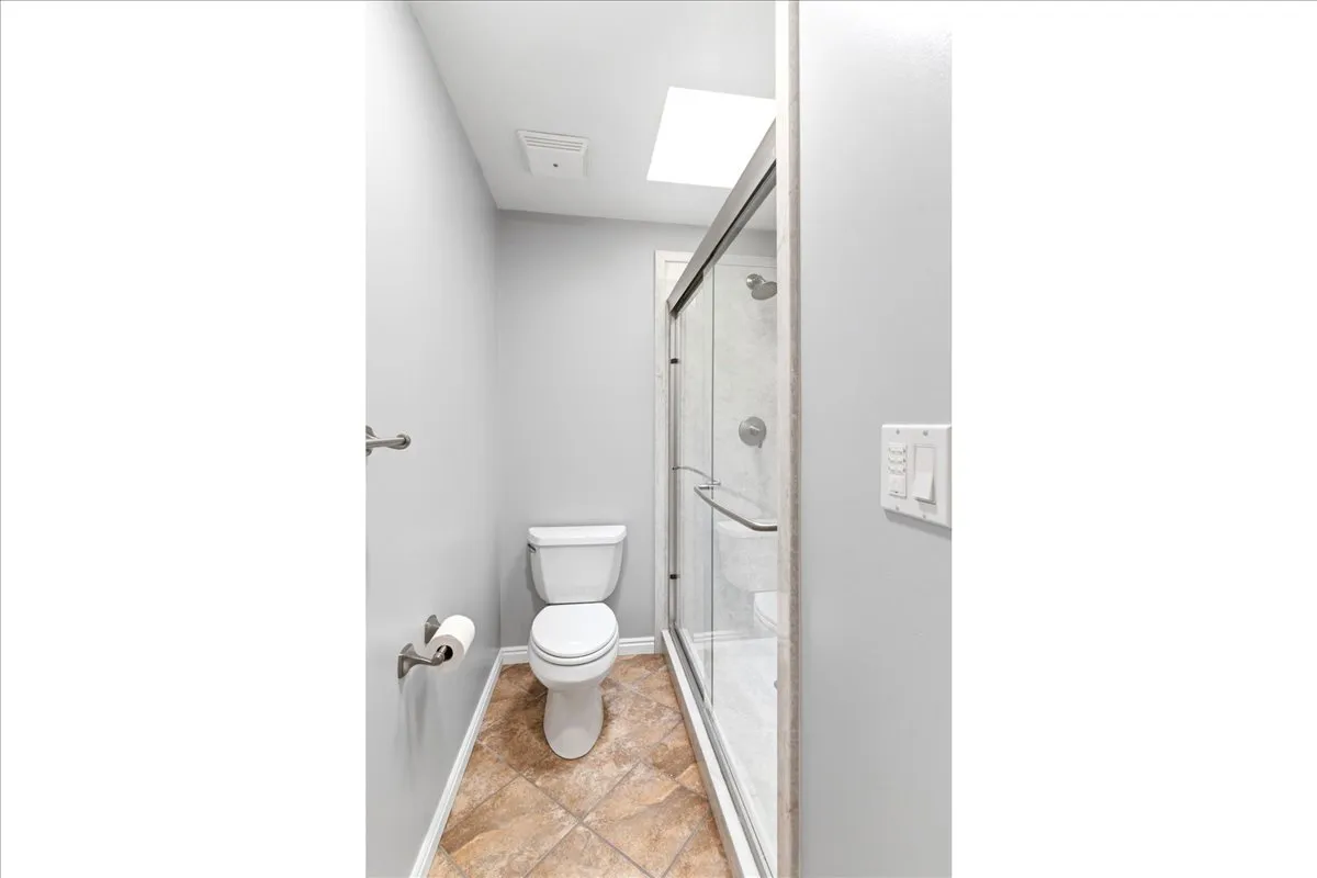 Primary bathroom features soft-close drawers & spacious shower with cultured marble shower surround