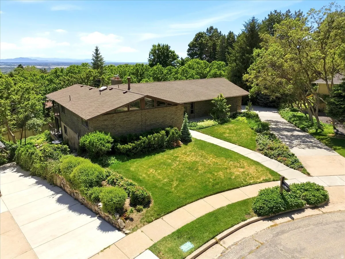 Established North Ogden neighborhood with mature trees and mountain views. New roof (2023), new gutters (2023)