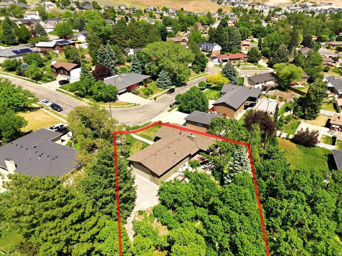Single-story residence with a brown shingle roof, integrated garage, and a concrete driveway