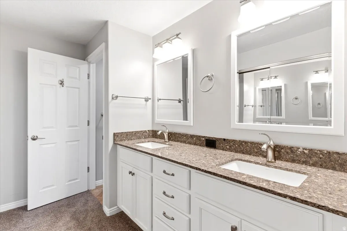 Primary bathroom features soft-close drawers & spacious shower with cultured marble shower surround