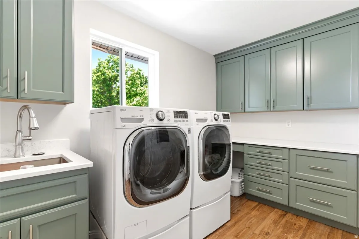 Updated laundry (2021) on the main floor with tons of storage, quartz countertop for folding, and washer & dryer included!