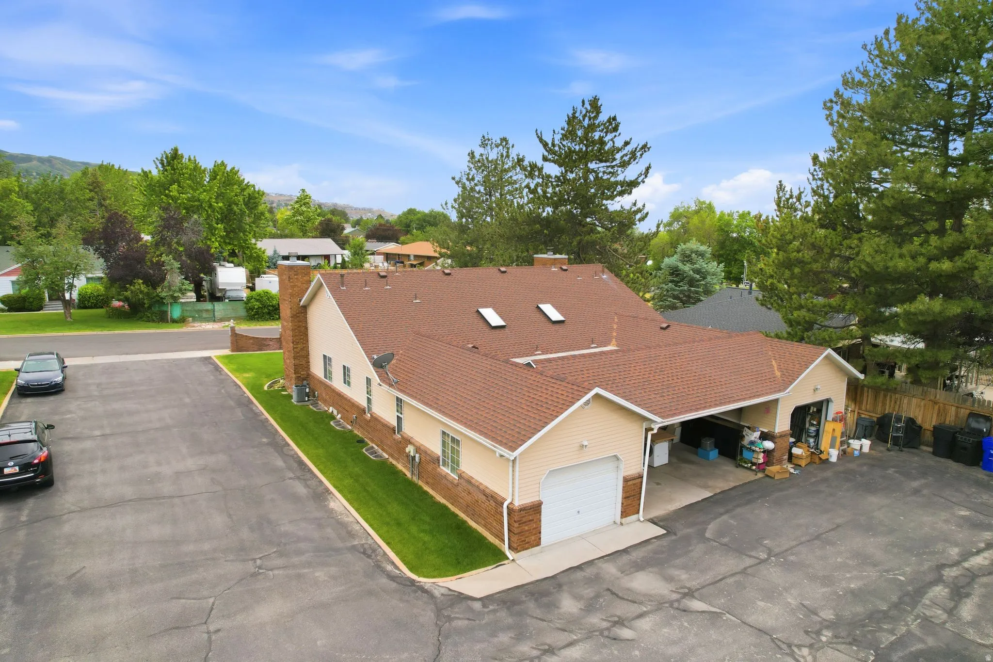 Expansive asphalt driveway providing ample parking