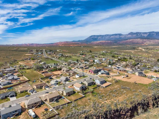 Expansive aerial view showcasing residential properties within a rural landscape