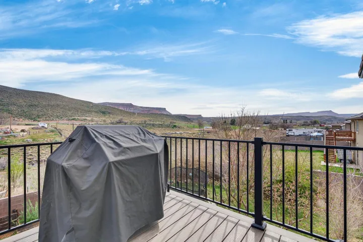 Outdoor deck featuring composite decking and black metal railings