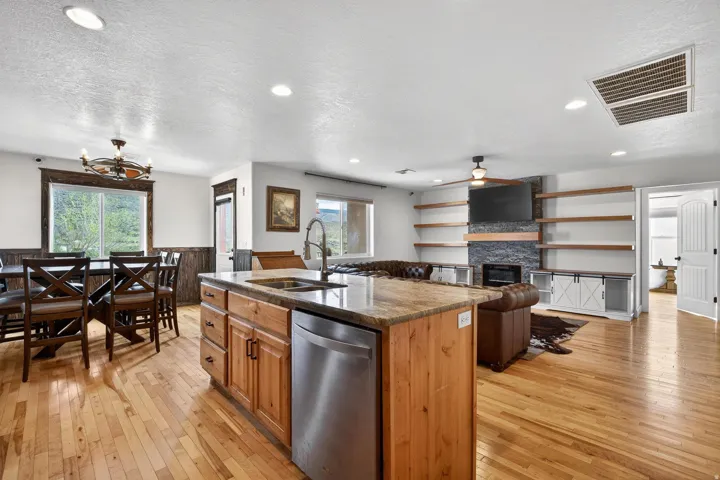 Open-concept living space featuring wood-finish flooring throughout