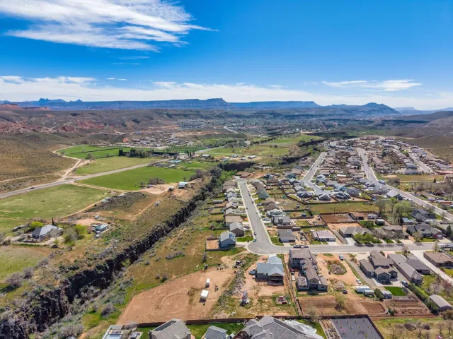 Aerial perspective showcasing a residential development with established homes and new construction