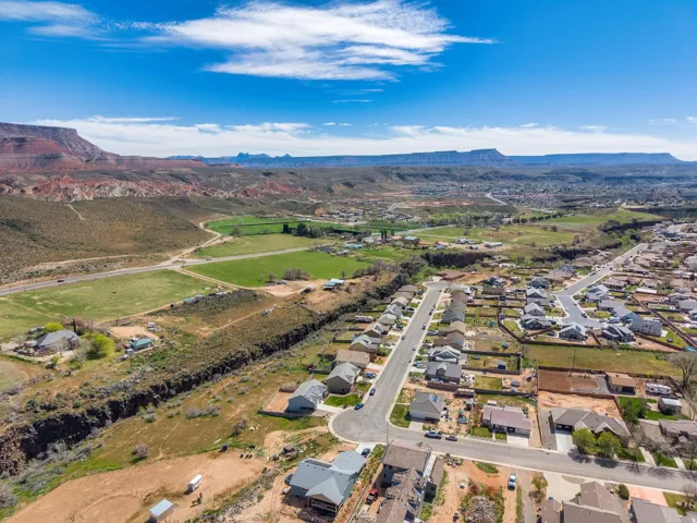 Expansive aerial view of a residential neighborhood with diverse rooflines and varying lot sizes