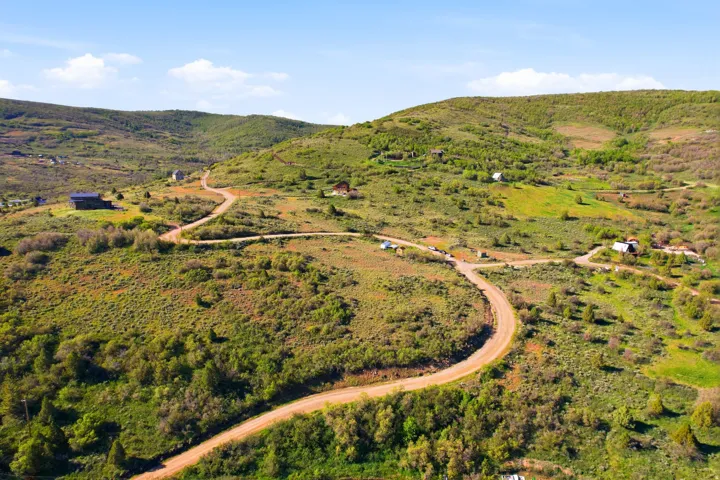 Expansive rolling hills featuring natural terrain and sparse vegetation