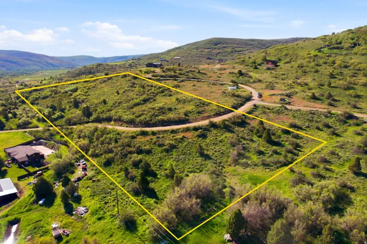 Expansive undeveloped land parcel featuring varied topography and natural vegetation