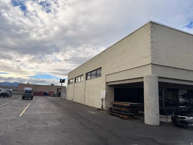 Commercial building featuring a textured stucco exterior and a flat roofline
