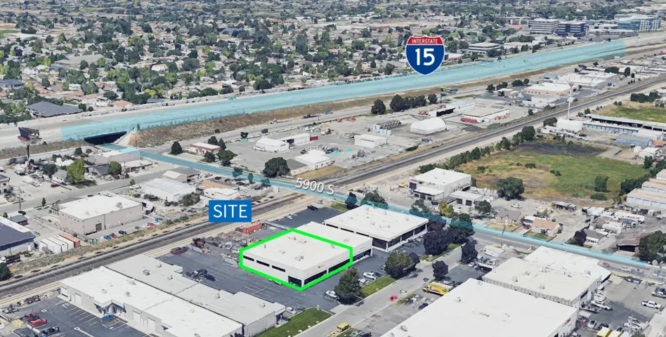 Commercial property featuring a flat roof and a paved parking area