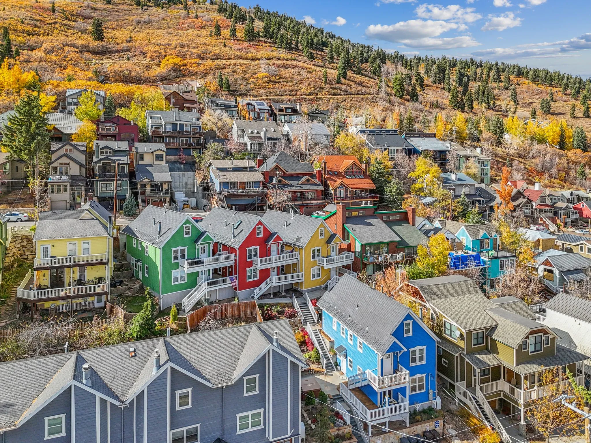 Hillside community featuring diverse architectural styles and multi-level residences