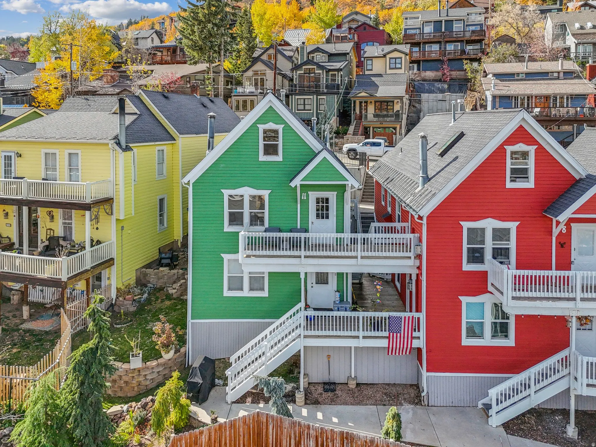 Colorful multi-level residences featuring prominent gables and white trim