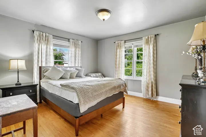 Hardwood flooring complemented by light-toned wall finishes and white trim