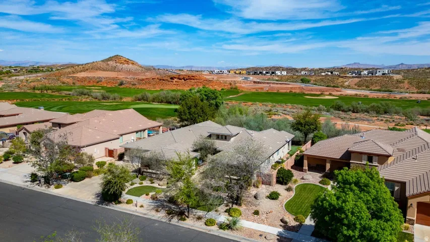 Aerial perspective showcasing properties bordering a golf course