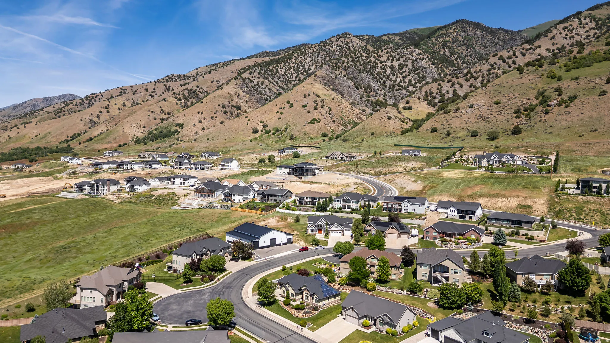 Expansive residential development featuring a mix of completed homes and properties under construction