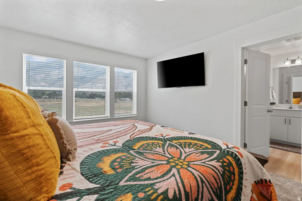 Bright interior space featuring three large windows with horizontal blinds