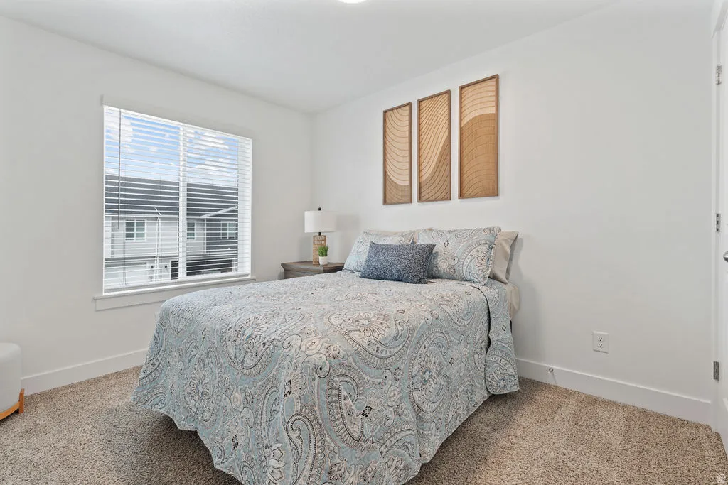 Room featuring neutral wall paint, white trim, and light-colored carpet flooring