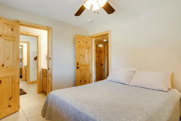 Bedroom featuring neutral wall paint and light-colored tile flooring
