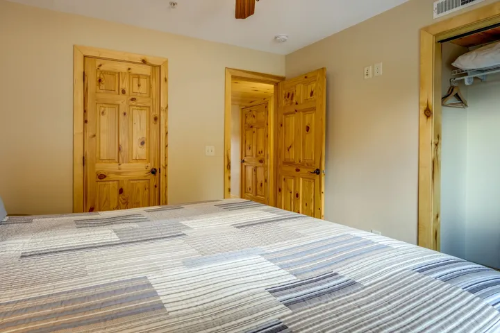 Warm wood-finish paneled doors with matching trim