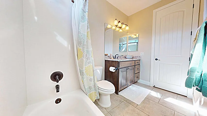 Tub and shower combination with oil-rubbed bronze fixtures