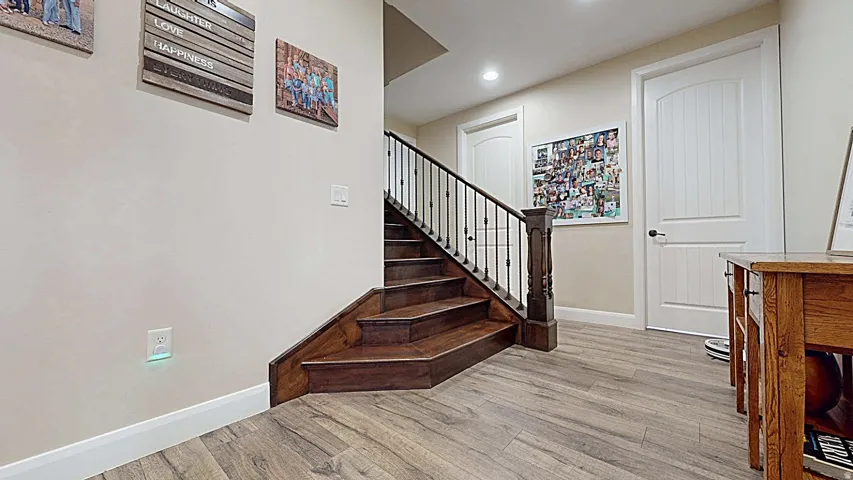 Wood-finish flooring with a contrasting white baseboard