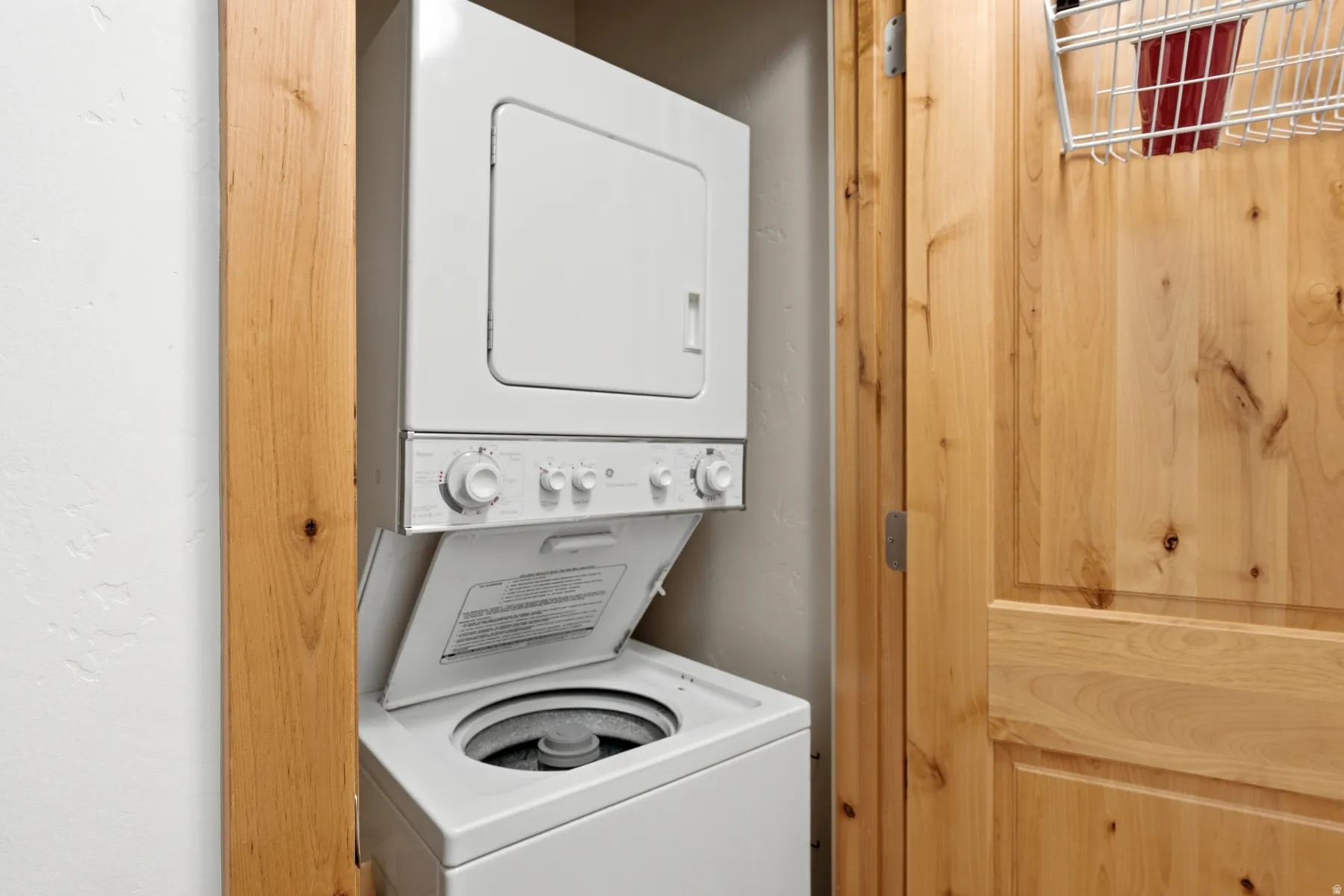 Stackable laundry appliances within a dedicated utility space