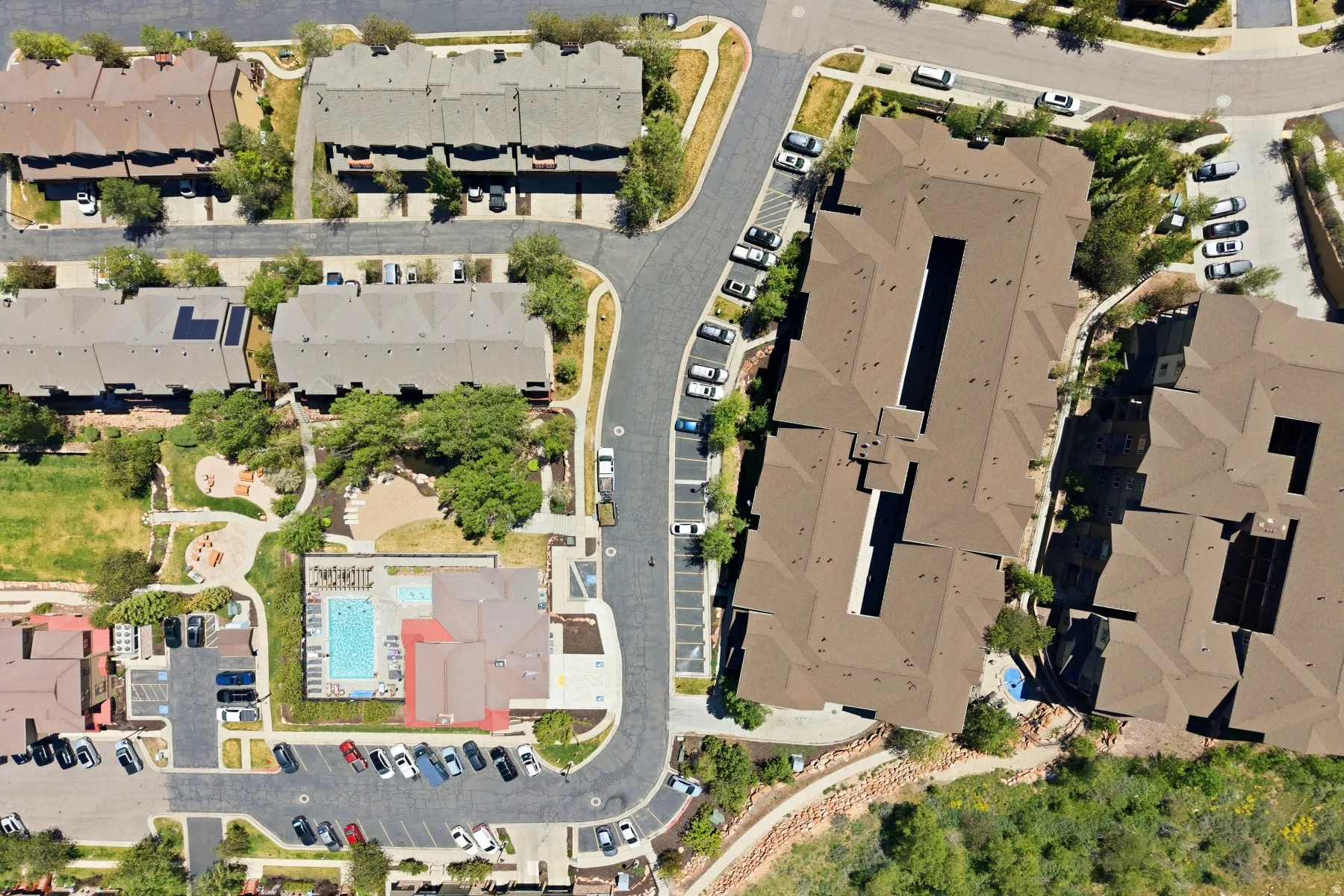 Aerial overview showcasing multiple residential buildings with varying rooflines