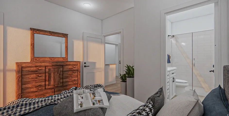 White interior walls with recessed lighting and wood-finish flooring