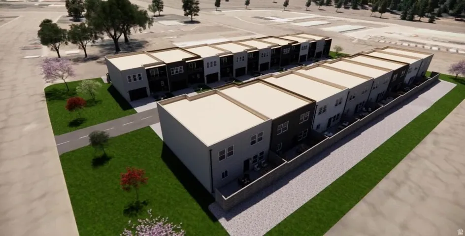 Modern townhome development featuring a consistent architectural design, private rear patios, and attached garages