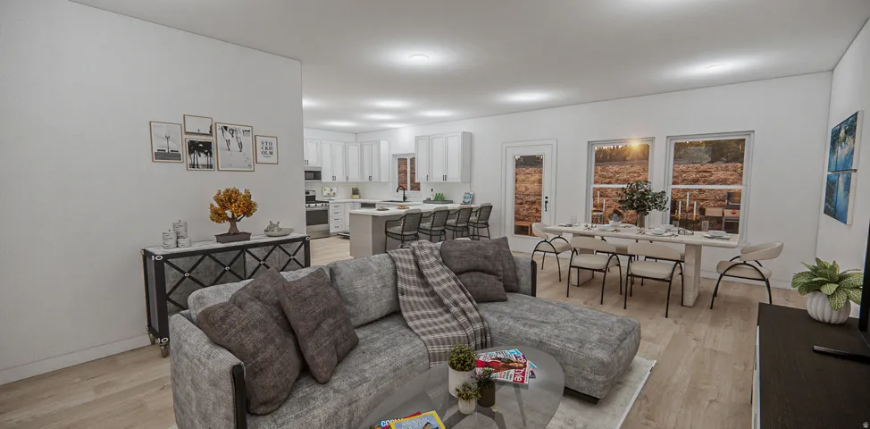 Open-concept living area featuring light wood-finish flooring, recessed lighting, and a white color palette
