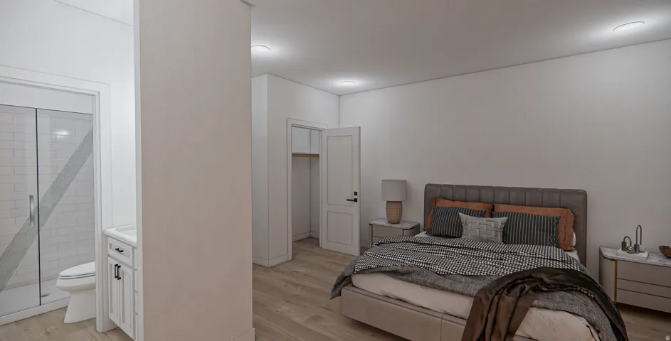 Bedroom featuring wood-finish flooring, recessed lighting, and a white interior door