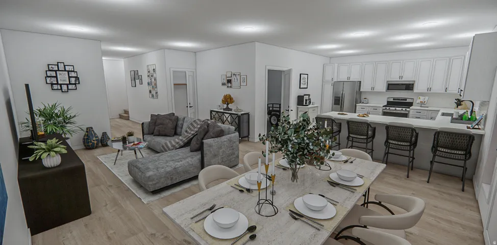 Open-concept living space featuring wood-finish flooring, a contemporary kitchen with white cabinetry, stainless steel appliances, and a substantial island with seating