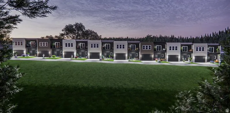Modern multi-story townhomes with dark garage doors and contrasting facade colors