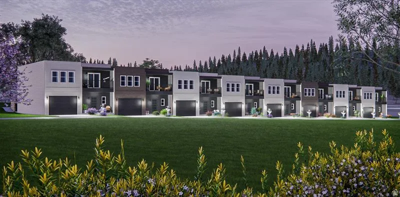 Modern townhomes featuring varied exterior finishes, integrated garages, and private balconies
