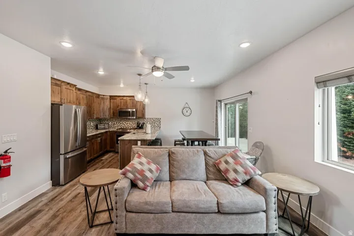 Open concept living area featuring wood-finish flooring