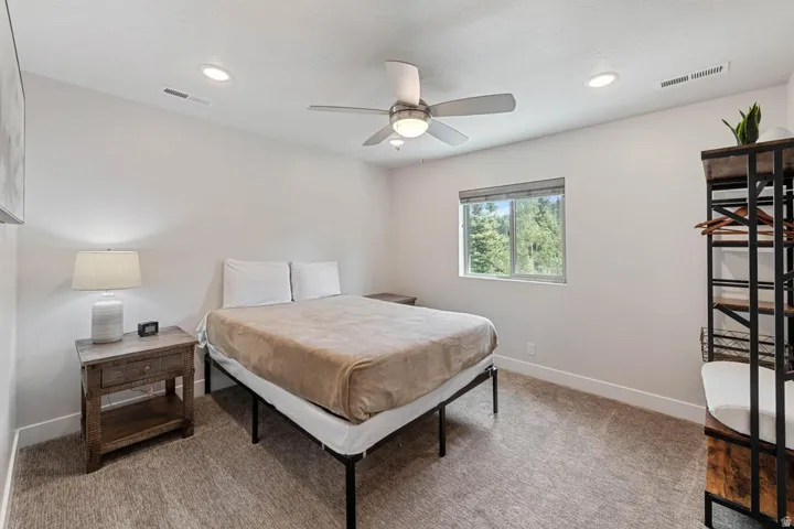 Bedroom featuring neutral carpeting and light-colored walls