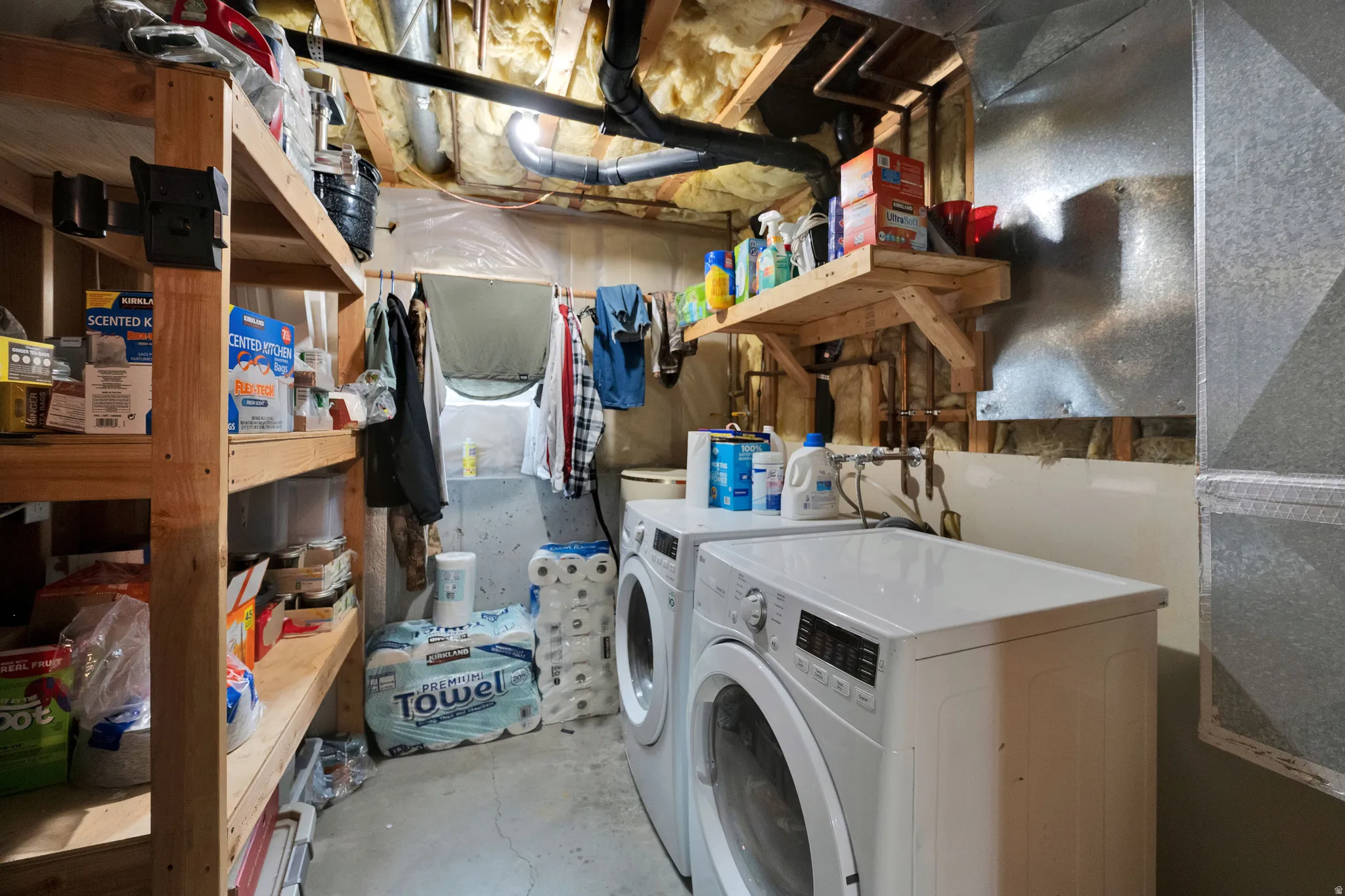 Dedicated laundry room and utility room with storage.