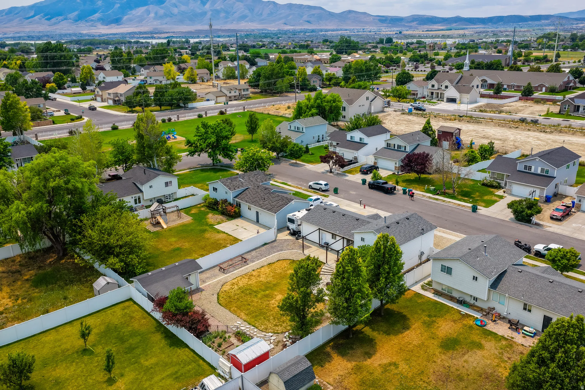 Overhead perspective showcasing a residential neighborhood with a distant mountain range