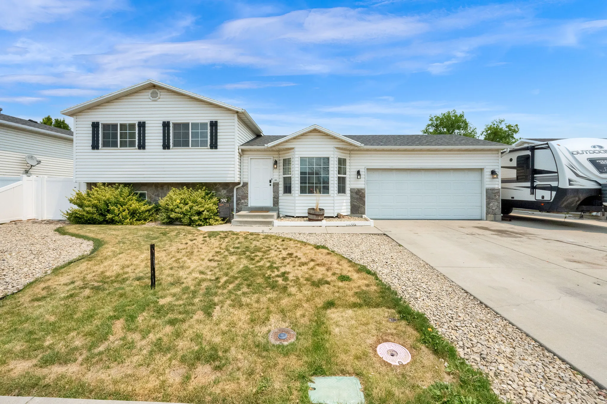 Tri-level home with 2-Car garage and RV parking.