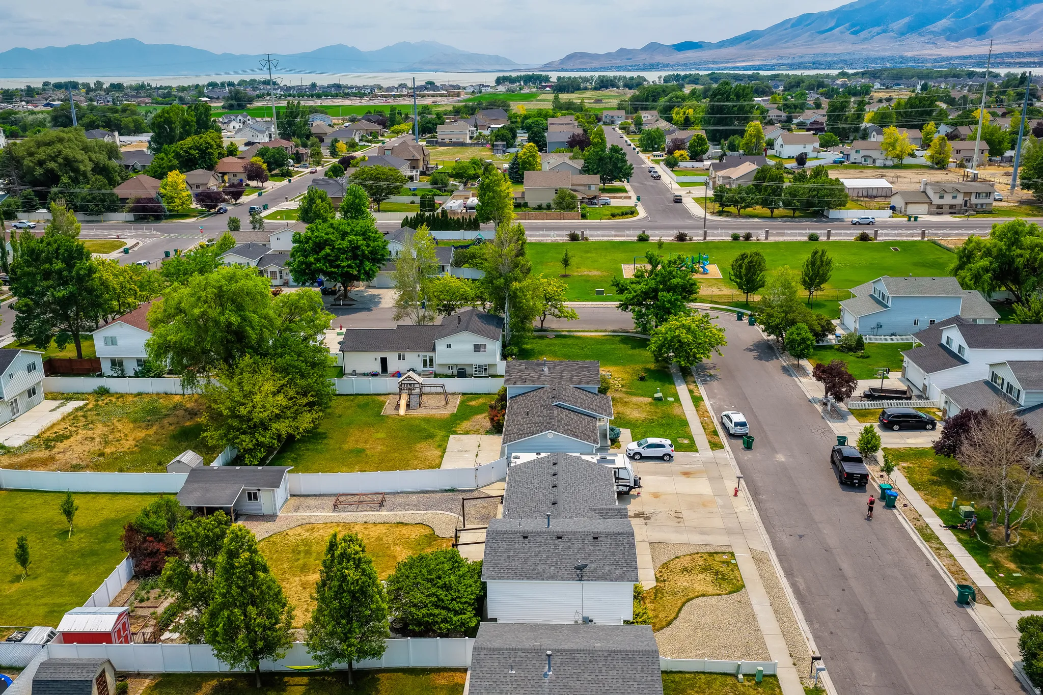 Residential neighborhood featuring single-family homes with established landscaping and mature trees