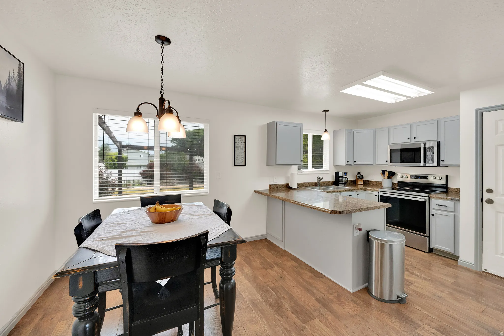 Kitchen and dining area, with LVP flooring.