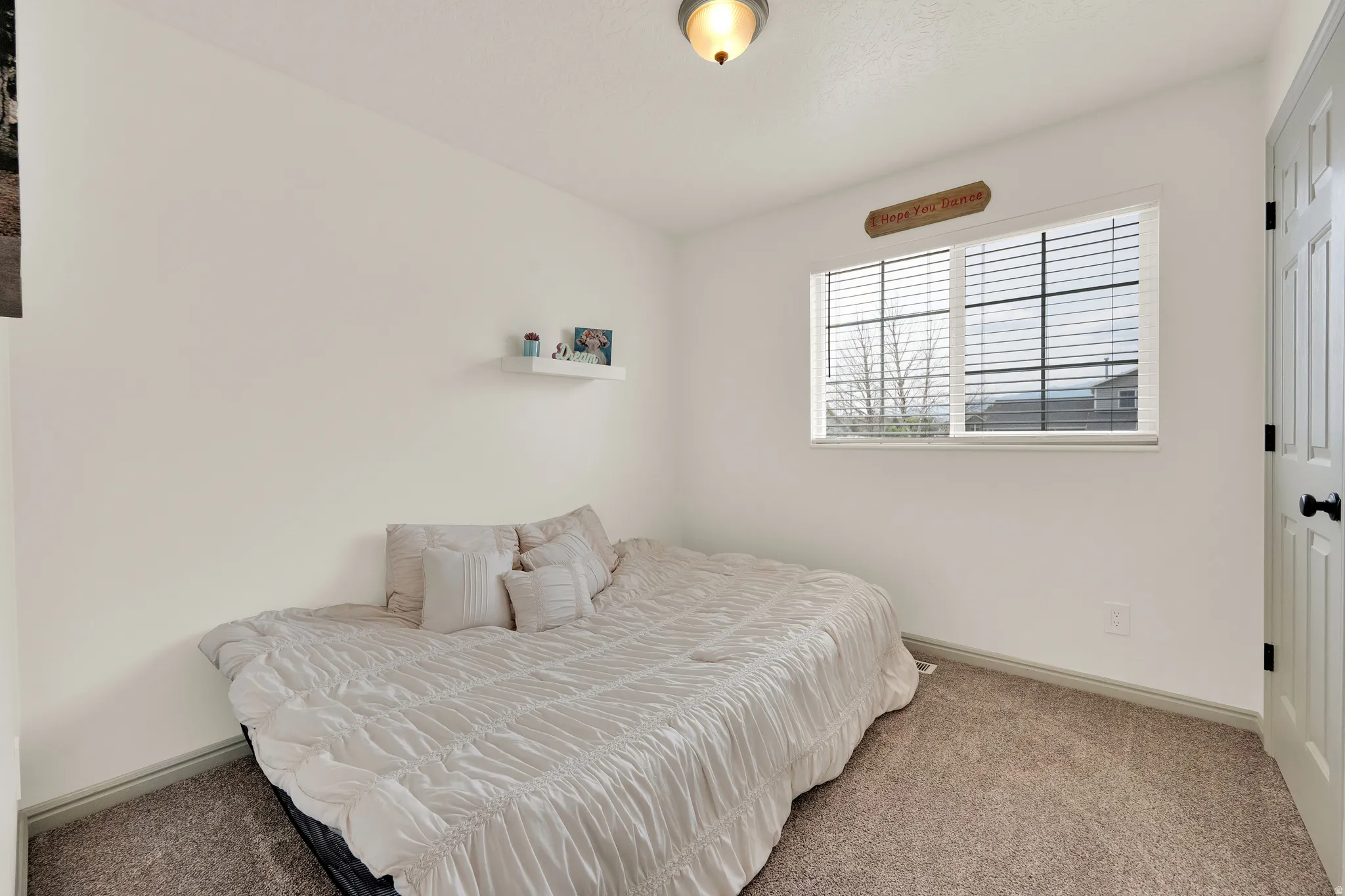 2nd guest room featuring bright daylight window.