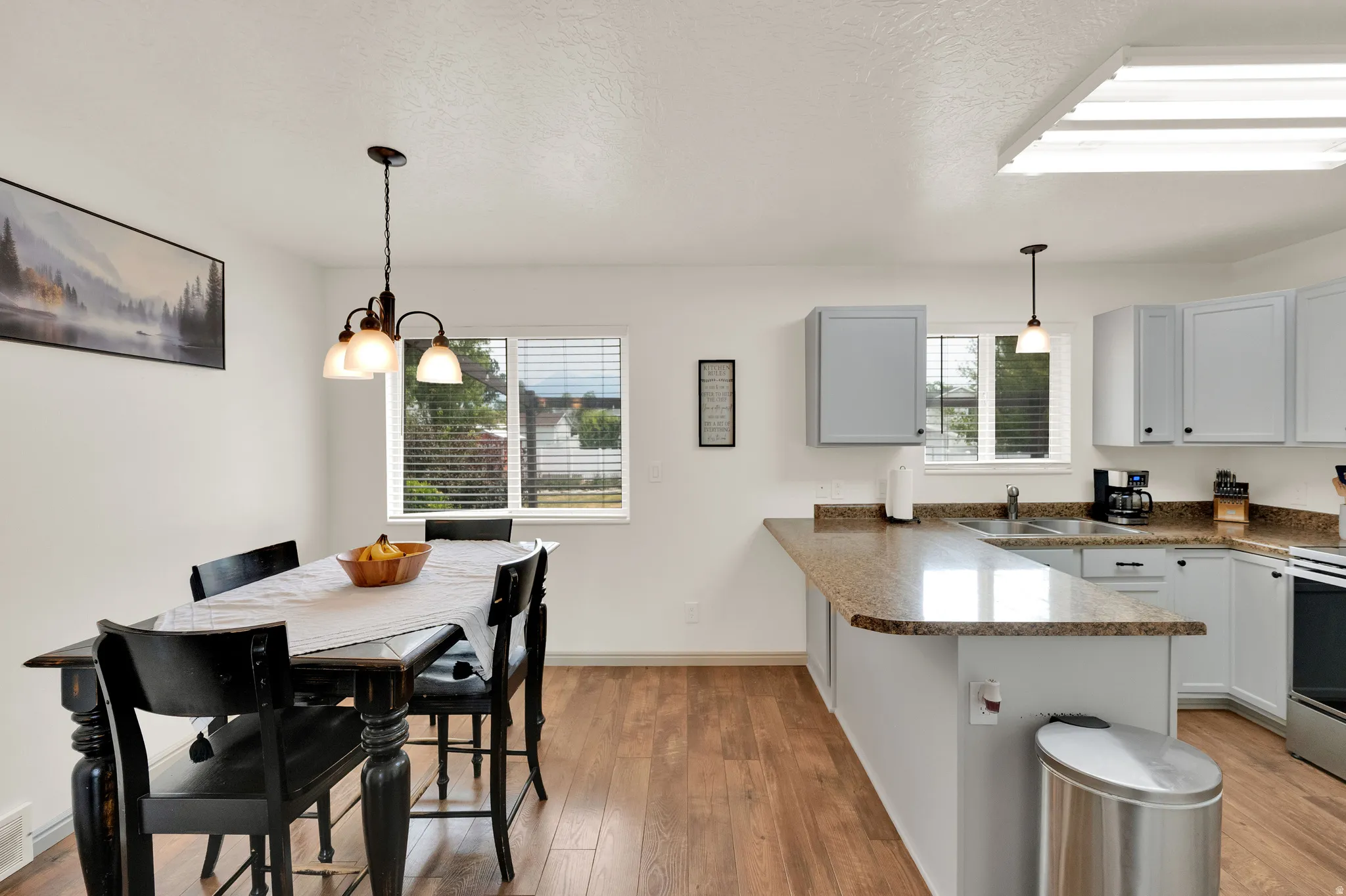 Kitchen and dining area, featuring stainless steel appliances and views of Mt. Timpanogos.