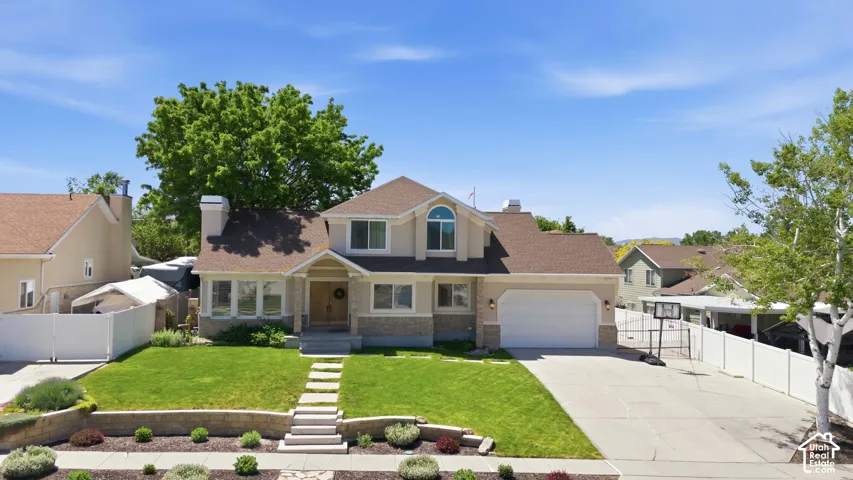 Two-story residence featuring a front entry porch, a one-car garage, and a concrete driveway