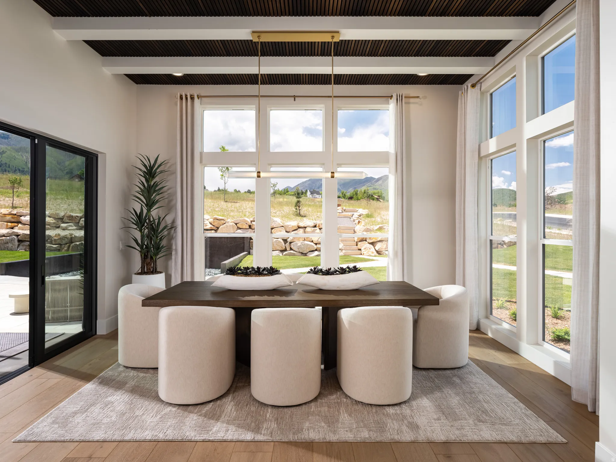 Dining area with wood-finish flooring and a coffered ceiling